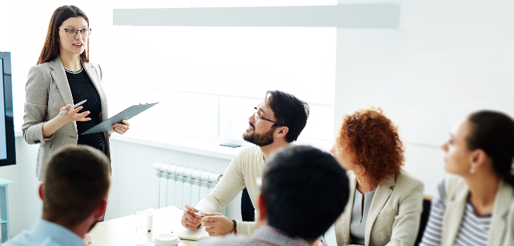 Businesswoman gives presentation in conference room