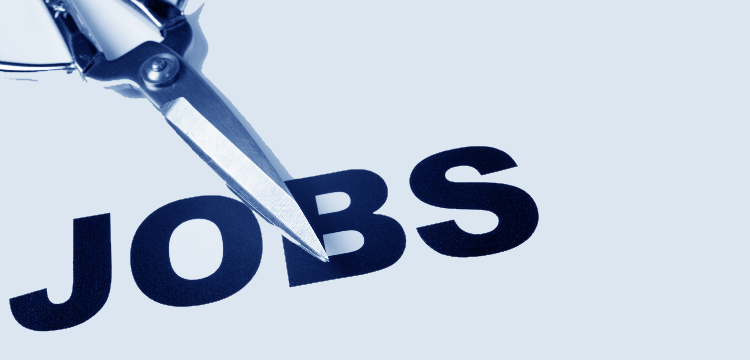 Closeup of the word "jobs" written in large font with scissors resting on top of the paper