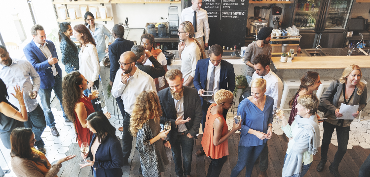 Crowded networking event at coffee shop