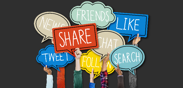 Various hands holding up speech bubbles with social media related words in them