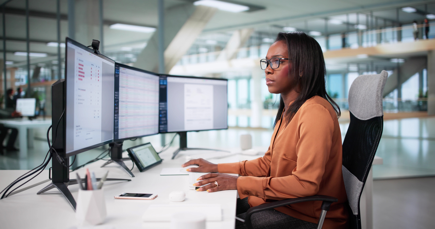 Woman managing accounts on computer